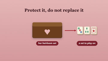 A wooden keepsake case with a heart beside a second set of tiles to play on