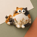 Calico Cat Figurine with Wildflower Belly, flat lay
