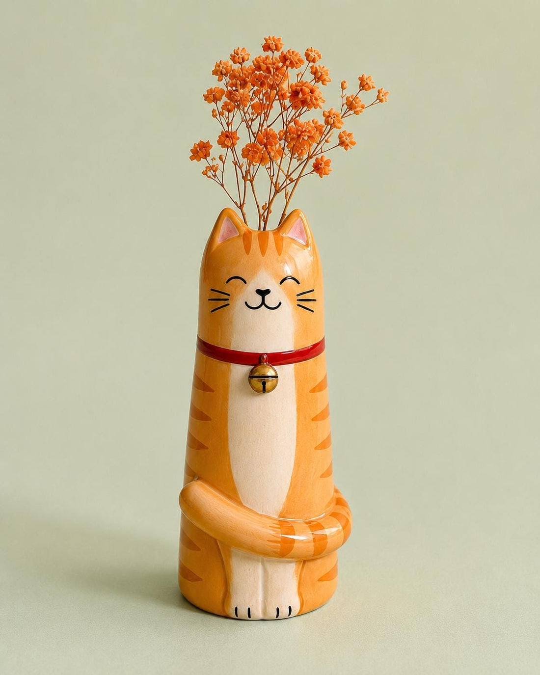 Ginger Cat Bud Vase with a Red Bell Collar, on a plain background