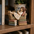 Girl Reading on a Tiny Sofa Clay Figurine, styled in a home setting (view 2)