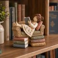 Girl Reading on a Tiny Sofa Clay Figurine, styled in a home setting (view 3)