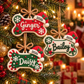Personalized Dog Bone Ornament with Name and Santa Hat, three designs hanging on a tree