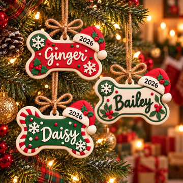 Personalized Dog Bone Ornament with Name and Santa Hat, three designs hanging on a tree