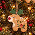 Personalized Reindeer Name Ornament, Hand-Painted Clay, with the name Theo
