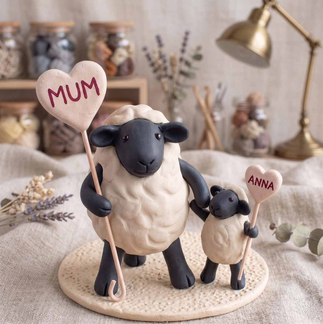 Personalized Sheep Family Figurine with Heart Names, styled in a home setting