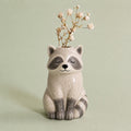 Raccoon Bud Vase, Hand-Painted Clay, on a plain background