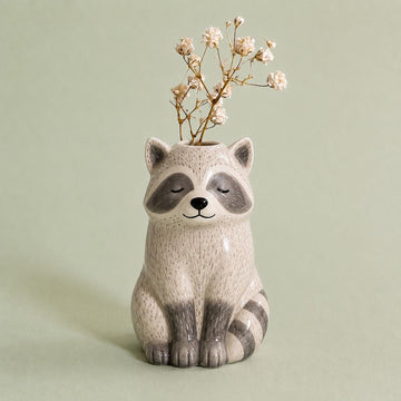 Raccoon Bud Vase, Hand-Painted Clay, on a plain background