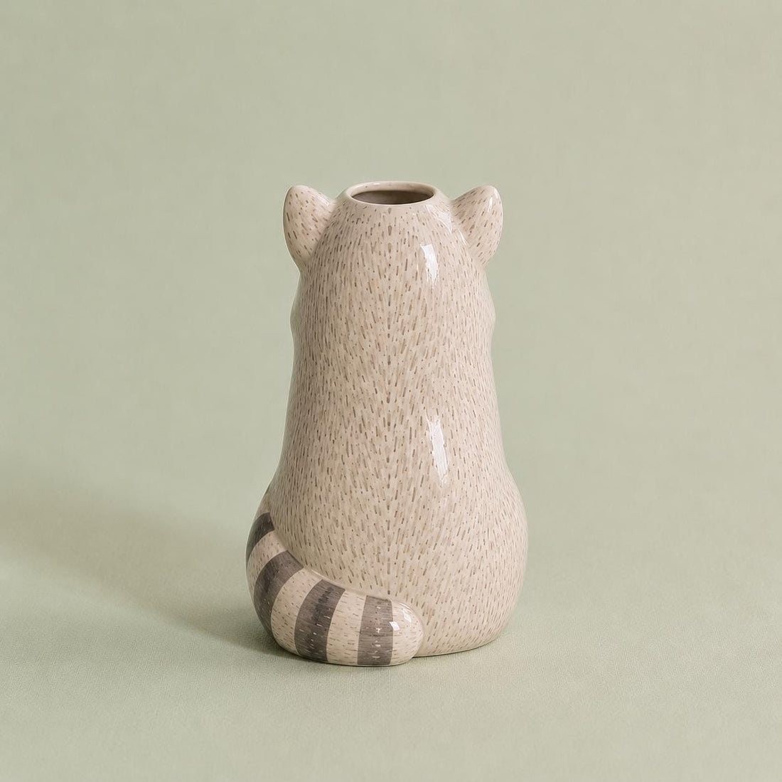 Raccoon Bud Vase, Hand-Painted Clay, on a plain background
