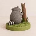 Raccoon Hugging a Tree Stump Figurine, back view