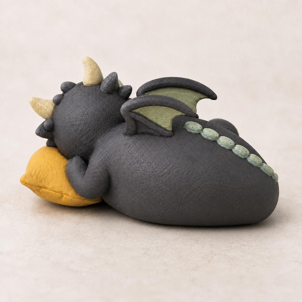 Sleeping Dragon with a Moon Book on a Yellow Pillow, side view