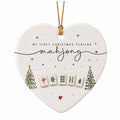 White heart-shaped ceramic ornament with two small Christmas trees, mahjong tiles and the words My First Christmas Playing mahjong