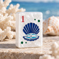Ocean Coral and Sea Turtle American Mahjong Set, 152 Pearl Tiles, a shell and pearl tile on sand