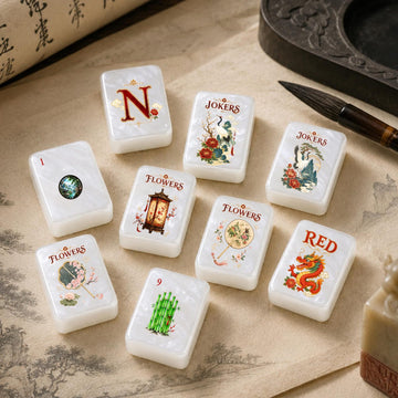Oriental Crane and Dragon American Mahjong Set, 152 Pearl Tiles, tiles with cranes, peonies and a red dragon on a desk with brushes